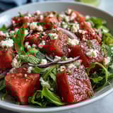 Vibrant Watermelon and Arugula Salad with feta and lime vinaigrette—a light, healthy meal perfect for hot days.  
