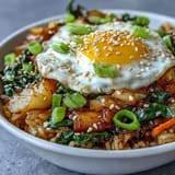Flavorful kimchi fried rice bowl, a quick Korean-inspired meal with vibrant veggies.