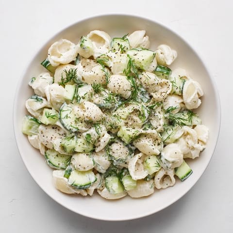 Cold Cucumber Crunch Pasta Salad tossed in tangy dressing, finished with everything bagel seasoning for extra texture.  