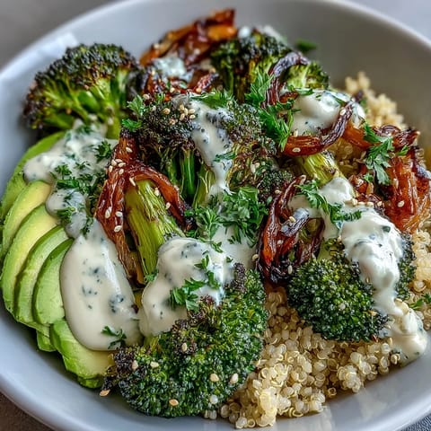Vibrant roasted broccoli bowl with crispy florets, hearty grains, and creamy tahini drizzle, perfect for a healthy vegetarian lunch.
